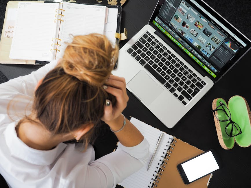 Woman overwhelmed at her desk